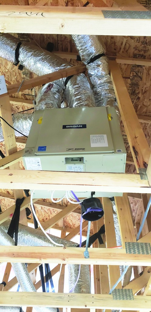 The Broan ERV shown above runs continuously, providing fresh air to the home. In the most recent generation of Mandalay Homes houses, the ERV is integrated with the ductwork serving the home’s heating and cooling system, which continuously distributes air through the house.
