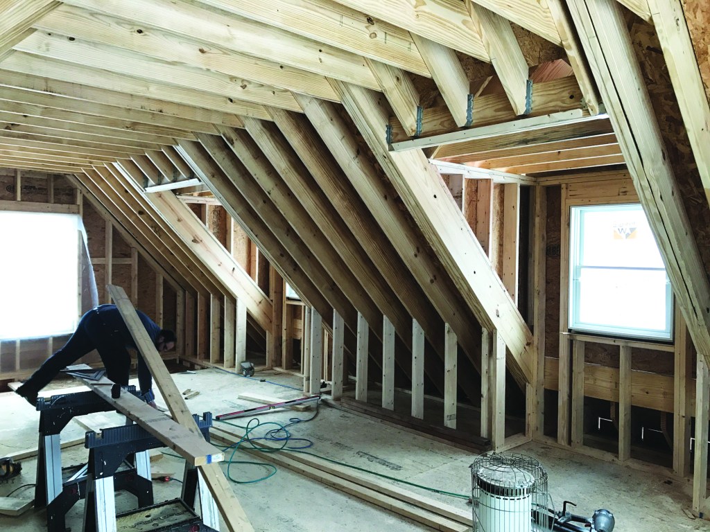 This occupied room over a garage included a substantial area of cathedral ceiling.
