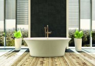 Elegant bathtub in modern bright bathroom with cityscape behind windows