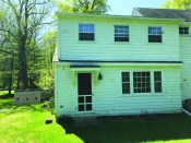 The original sagging dormer and roof-soffit assembly below revealed the building’s out-of-whack nature to the eye.