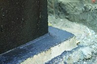 A bitumen foundation coating will help to prevent water from being absorbed into concrete.