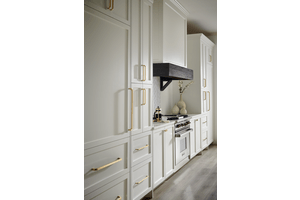Cabinet pulls of various sizes from the Davenport series in the Ellis hardware collection, shown here in a Honey Bronze finish.
