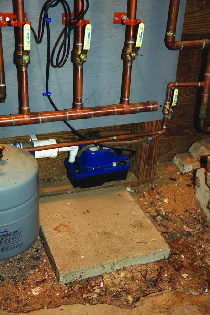 Condensate from a condensing boiler drains into a reservoir and is then pumped safely to the outdoors.