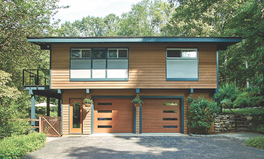 New doors, porcelian panels, and a complementary paint scheme brought what had been a tired exterior into fresh focus.