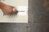 Hand holding a trowel