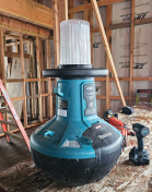 Makita LED area light in a house under construction