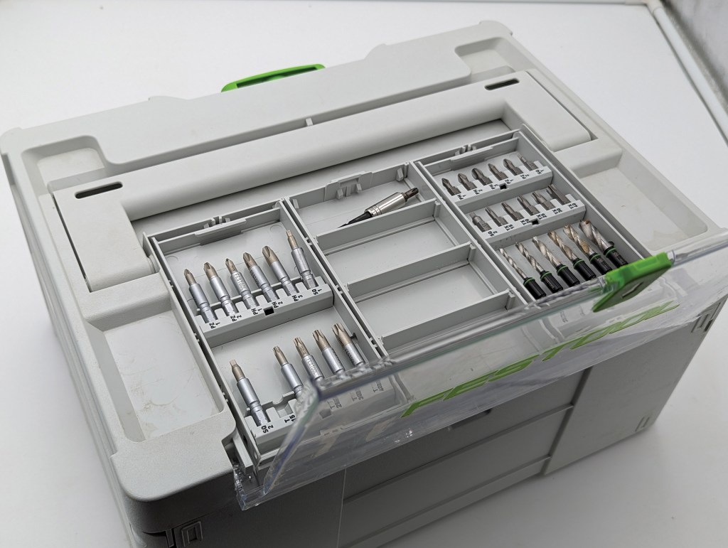 Clear cases on the top of the Systainer hold bits in magnetic slots.