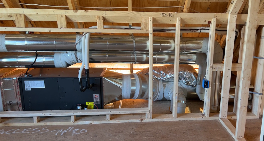 One of three Mitsubishi air handlers in the Queen of Zero home (AH2 serving the second floor as shown on the elevation below).