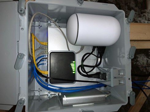 The equipment box contains a POE (power over ethernet) switch, the UniFi “Cloud Key” (which runs the camera controller and saves all the video), a wireless AP, and a cellular modem. Unable to find such a system pre-made, the author set-up this system himself, including making the weatherproof enclosure.