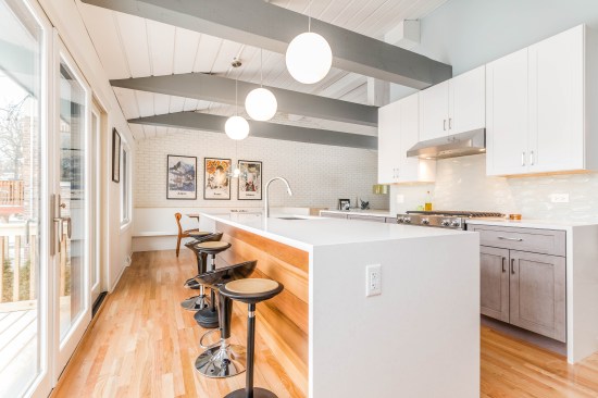 Kitchens increasingly are planned with one entire wall dedicated to windows and glass doors to connect with the outdoors.