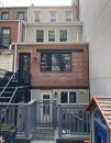 Before work began, the building stepped back on the second and third levels. Additions on the two levels will align with the brick wall of the main level.
