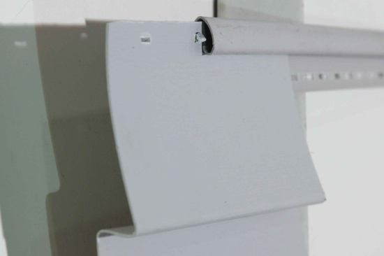 A specialized trim piece called a “utility” or “finish” channel is spring-loaded on one side.
