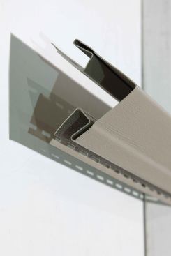 ... and outside corners up to the soffits, leaving a ¼-inch expansion gap at the top (see“Corner Posts”)