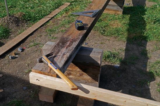 I then snapped a line 4 inches in from the edge of the uphill timbers. Measuring across to the downhill timbers, I snapped a second, parallel line. These parallel lines, marked out on both sets of runners, served as reference points.