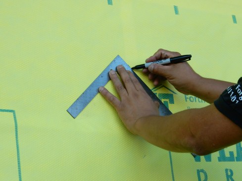 Step 1 (cont.). Cut Housewrap/WRB.Connect “outer” mark with top corner of rough opening, making a 45-degree line. It’s important to get this lap cut right, head laps are often sliced at different angles and lengths, which are harder to seal.