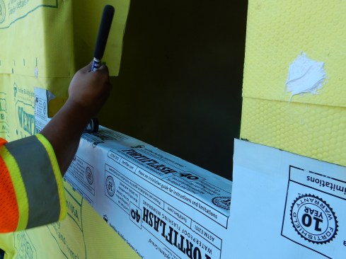 Step 3 (cont.). Apply Sill Pan Flashing. Roll the all peel-and-stick flat with a J-roller, being be careful not to create wrinkles. You’d be surprised, I don’t often see installers actually using a J-roller, but this tool helps improve adhesion of SAF, even in cold and wet conditions.
