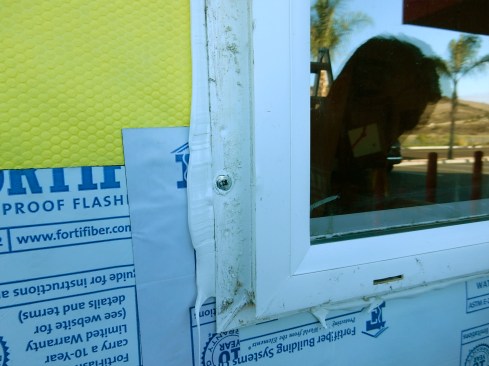 Step 5. Window Install.Set the window level, square and plumb. Shim as required. When installing, ensure that sealant “squeeze-out” exists everywhere sealant is used—along the edge of the nailing flange and at all the pre-punched holes. Proper squeeze-out confirms that the window is adequately set in sealant. Use exterior-grade, self-tapping pancake screws, 8 to 12 inches on center; the compression from the fasteners help "gasket" seal window fins to the WRB and sheathing at head.
