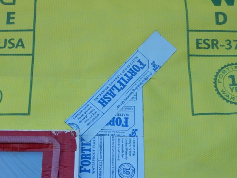 Step 9 (cont.). Tape off head flap.Tape the head lap closed at the ends. Strips of SAF membrane are an improvement over flashing tape products, but the tape will work, too. If the flap needs to be taped along the bottom edge, use short pieces with gaps between them so if any water gets behind there, it can drain out.