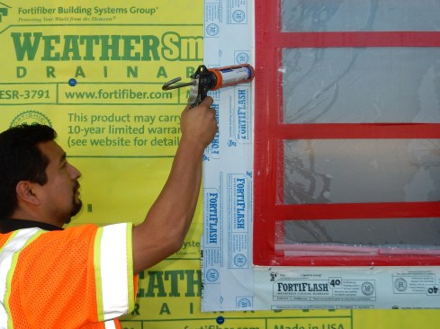 Step 10. Seal side-flashing edge. For added protection, apply a bead of sealant along the edge of the side flashing where it butts into the window frame. This will help if the SAF does not adhere properly to the nail fin due to dust, cold, or moisture.