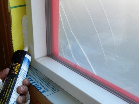 Step 12. Sealing the Interior. On the inside of your window, apply a bead of sealant 6 to 8 inches down each side and all the way across the bottom.