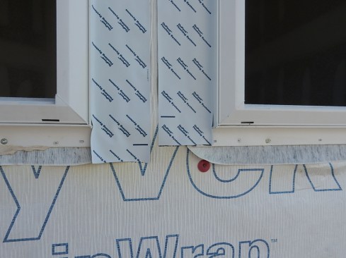 In addition to the side flashing running too short, the cap fastener is too close to the opening. If the side flashing had been extended downward to cover the flexible flashing, it would have at least partially covered the cap fastener. When water gets under the SAF for reasons previously discussed, it will use the fastener penetration to get in the wall.