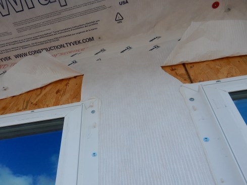I commonly see WRB head laps sliced at different angles and lengths. Head laps should be cut at 45 degrees and to the width of the head and side flashing—no more, no less. Take the time to properly measure, mark, and cut the WRB.