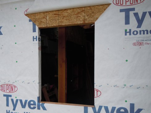Step 1. Cutting the Housewrap/WRB. Properly measure, mark, and cut the housewrap at each rough opening. I recommend using an “I-cut” and turning the flaps into the opening. I believe it’s a more foolproof method. It’s too easy for installers—who are typically in a rush—to overcut the housewrap when cutting the sides flush to the opening. Cut a flap in the housewrap at the head at a 45-degree angle and to the width of the flashing, temporarily hold it up with tape.