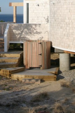 You won't get cornered in this cylindrical shower built next to a home with curved walls on the shores of Cape Cod Bay.