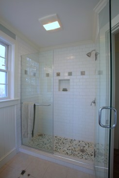 Roomy, well-lit master bathroom showers tiled from floor to ceiling have become important selling points in spec-homes and can actually cost less than the once-popular whirlpool baths.