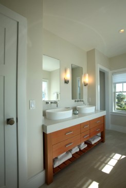 Save money in the master bathroom by installing two smaller mirrors over the sinks instead of one large mirror. The smaller mirrors add a more personal "his and hers" feel to the bathroom as well.