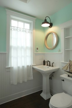 A powder room can be dressed up with high-quality finishes and unique plumbing fixtures to set it apart from a standard bathroom. The small size of the powder room help to keep extra costs to a minimum.