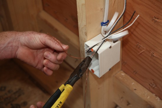 Next the author uses pliers to tighten the twist.