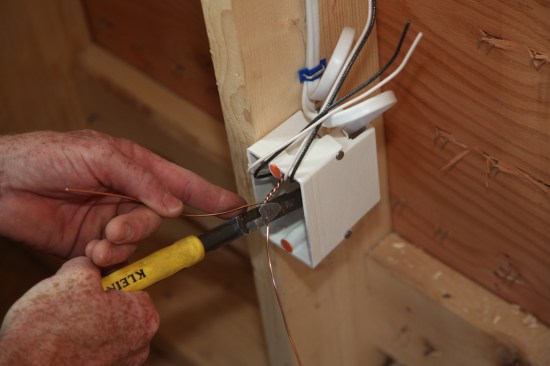 Because just a single ground conductor is needed, the author cuts off one of the connectors at the twist.