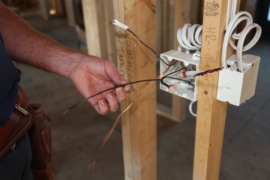 A pigtail twisted with the supply conductors will feed one of the switches. A short length of black conductor is twisted and wire nutted to the other two.
