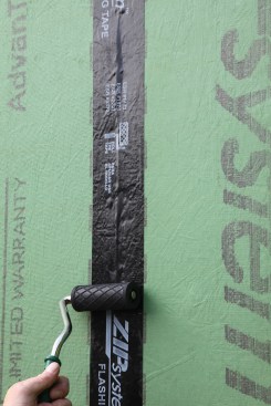 When finished rolling, the rough surface of the sheathing should telegraph plainly through the surface of the tape.