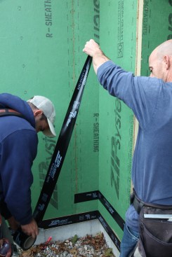 Inside corners can be the most challenging and a crew of two really helps. Working with shorter lengths of tape, one crew member keeps the tape folded while the other cuts the tape to length.