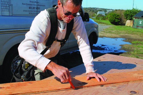 A factory edge from a rip makes a good straightedge for an angled cut.