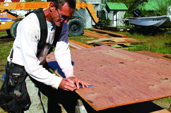 To mark a narrow rip, slide a layout square along the edge while holding a pencil at the measurement.
