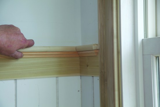 Giving the end of the coped trim a slight tap helps to close the joint for the final fit.