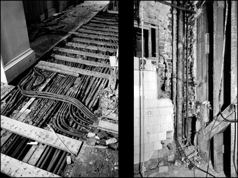Over the years, bearing walls and structural members were haphazardly cut into to make way for various advances in heating, plumbing, lighting, and communications. Here, a myriad of electric and telephone conduits on the second floor corridor are exposed during demolition (left), while a load-bearing brick wall was weakened at some point in time to make way for water pipes (right). To make matters worse, substandard materials were used in a number of renovation projects. Repurposed scorched timbers from the 1814 fire and used bricks contributed to premature structural failure, while second-hand water piping installed in 1927 caused water damage shortly after installation.