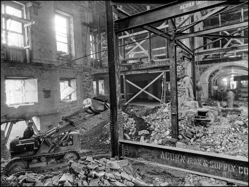 A bulldozer — taken apart, then reassembled in the interior shell to avoid cutting into the building’s historical façade — removes debris from the inside of the White House. Demolition work began in February 1950 and was complete by June 20, 1950. Days later the Korean War would begin, which would lead to project cost overruns and schedule delays due to rising material and labor costs.
