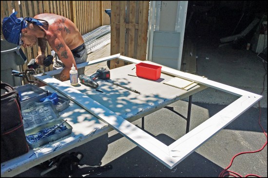 The author’s crew makes up the casing units using 2P10 adhesive and Kreg hidden screws, and installs the assemblies after the siding is done.