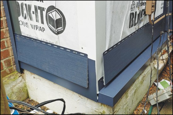 Wolf’s Baltic Blue comes with matching coil stock for fabricating the many different details that come up on nearly every job, including a receiver channel at the chimney, a false bottom course, and a capping for an extended foundation.