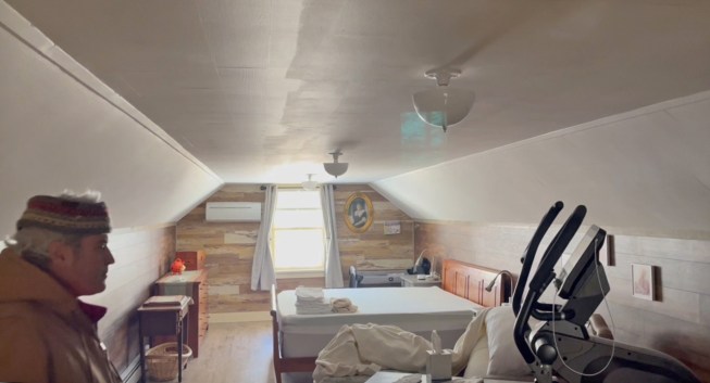 The 12x34 bonus room is used as an exercise room and guest bedroom. Without the benefit of side dormers to bring in light, the room’s length and 6’-8”-high ceiling give the room a somewhat cavernous feel (the dormer above the garage door is a faux dormer installed to divert water away from the door opening).