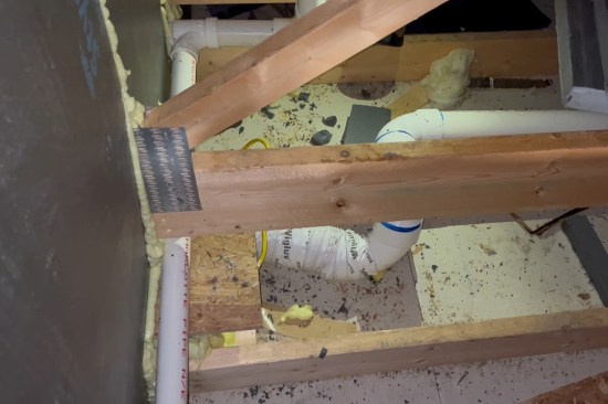 Here, new 4-inch rigid PVC “duct” is connected to a short length of 4-inch flex duct run (the existing bath fan was located under bonus room floor and difficult to access).