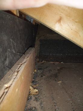 Looking both ways down the length of the soffit, I could see which direction the water was coming from. Working my way toward the source, it seemed that the water originated where the garage soffit intersected with the roof plane of the house, about 10 feet from the site of the staining. Now it was time to get out of the garage and back onto the roof.