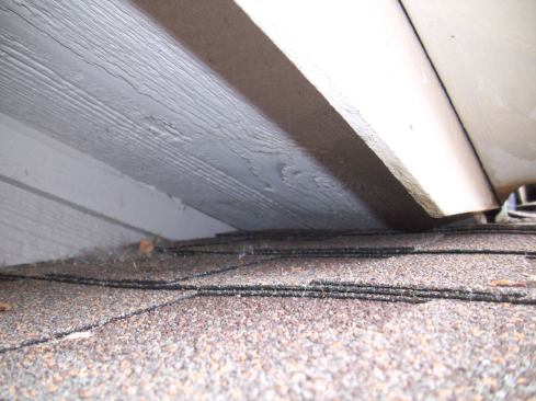 Still, these factors alone didn't create the problem. The soffit material had been run tight to the shingles and past the angled edge of the fascia.