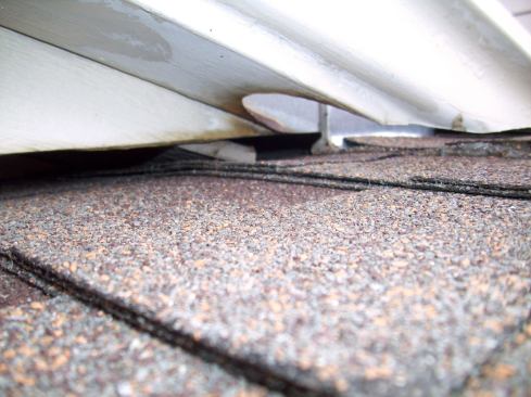 This combination created a scoop that allowed water to flow under the fascia and on top of the soffit. From there the water made its way down the soffit and finally behind the siding. I thought, "Look on the bright side: At least the water-resistive barrier behind the siding did its job well!"