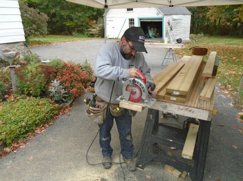 Author cuts drainage grooves in the face of the ledger stock that will help prevent water from sitting on top of them after they are installed.