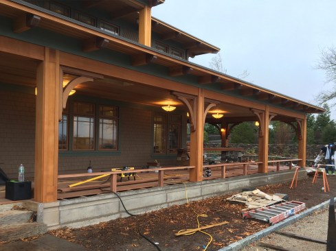 We began by installing vertical support posts between the deck’s major red cedar-clad columns, breaking the nominal 14-foot column spacing into three meticulously aligned and equally spaced sections.